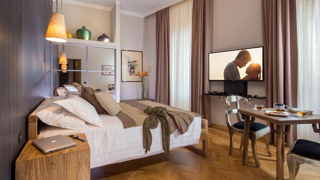 Qt Suites Roma الغرفة الصورة